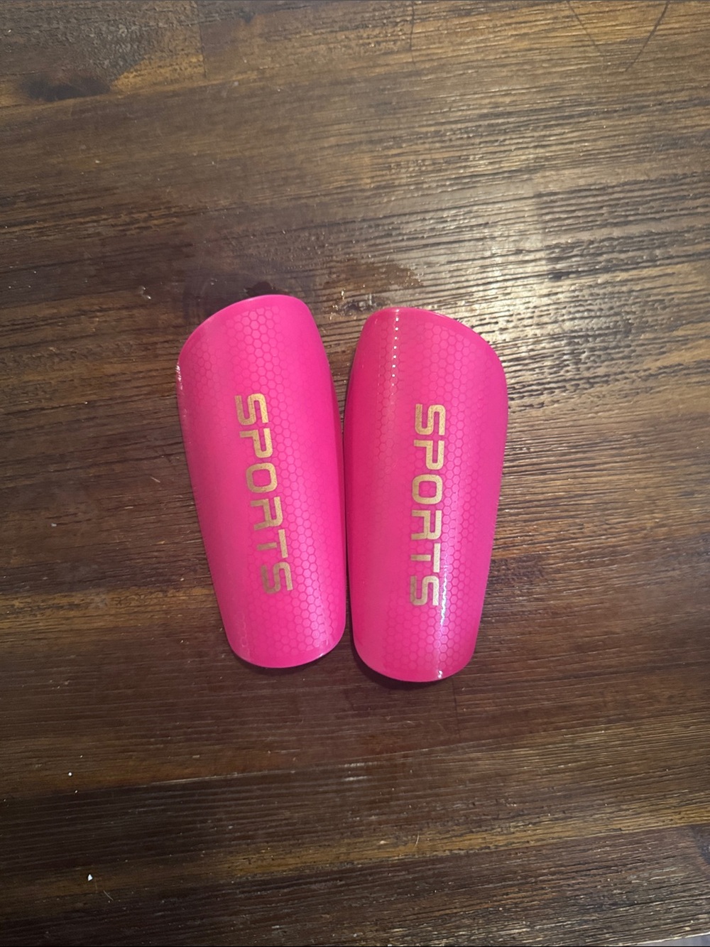 Amazon Pink Youth Shin Guards with Gold 'SPORTS' Logo